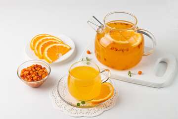 Sea buckthorn tea drink with oranges and mint. Autumn comfort hot drink. Herbal vitamin tea. 