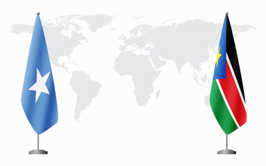 Somalia and South Sudan flags for official meeting against background of world map.