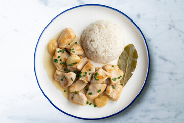 Garlic chicken with bay leaf aroma and white rice. Top view table with  decoration.