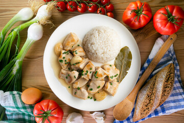 Garlic chicken with bay leaf aroma and white rice. Top view table with  decoration.