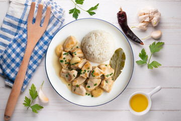 Garlic chicken with bay leaf aroma and white rice. Top view table with  decoration.