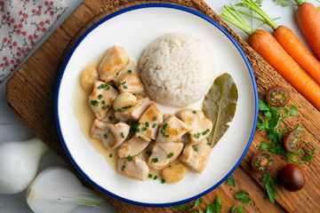 Garlic chicken with bay leaf aroma and white rice. Top view table with  decoration.