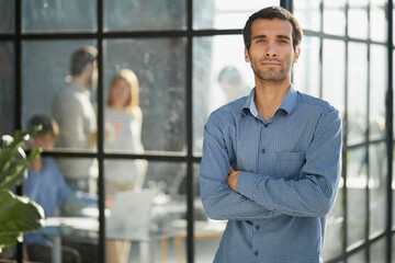 Middle aged white male creative in casual office lounge area looking to camera