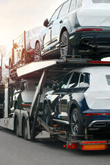 Fototapeta premium Modular hauler truck loaded with new vehicles