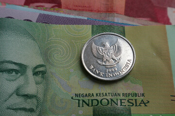 Indonesian banknotes and coin close up. Indonesian money.