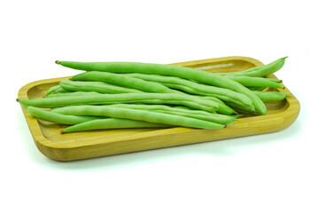 Group of french bean, haricot bean, snap bean, string bean in wooden tray isolated on white background closed up stack with clipping path