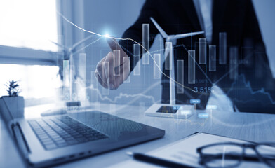 Turbines with graph and rising arrows.Businessman making development plan profits with business...