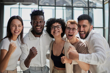 Smiling professional business leaders and employees group team portrait