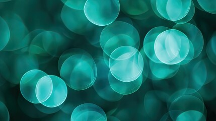 Cool blue-green bokeh, overlapping circular shapes with soft edges, created using macro photography, providing a serene backdrop with space for text.