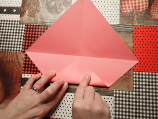Origami jewelry box made of colored papers. Step 5 from 12