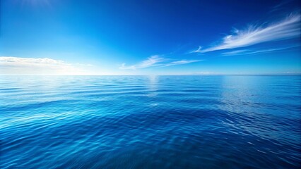 Obraz premium Azure Expanse, A Canvas of Serene Blue with Wispy Clouds Drifting Across a Vast, Calm Sea