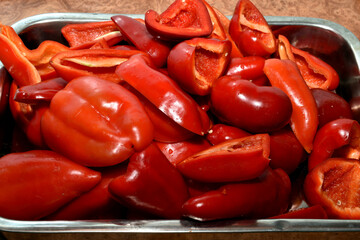 The seeded and washed sweet bell pepper halves are placed on a baking sheet.