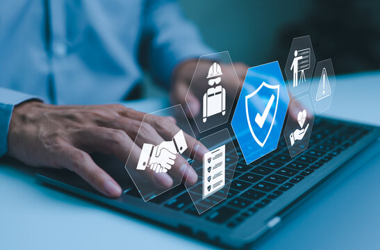 Work safety and compliance concepts. Businessman typing on laptop with virtual icons representing work safety, compliance, and security, workplace safety, and regulatory adherence. Safety first,