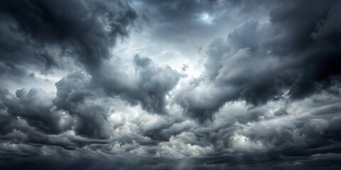 Obraz premium A dense, foreboding sky filled with heavy, dark clouds, creating a dramatic and ominous atmosphere.