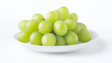 bunch of fresh green grapes on white plate, isolated on white background. grapes look juicy and delicious, perfect for healthy snack.