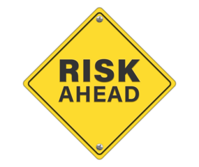 yellow road sign as a warning of risk ahead