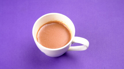 Top view of colorful working table have Headphones,mobile phone and cup of tea on color blue, Yellow and pink background for create idea for business or design. Relax time listen song (flat lay).