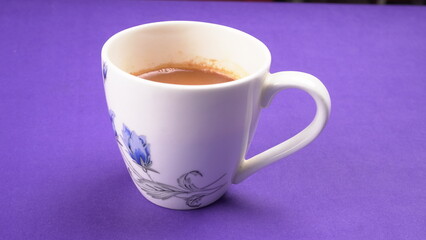 Top view of colorful working table have Headphones,mobile phone and cup of tea on color blue, Yellow and pink background for create idea for business or design. Relax time listen song (flat lay).
