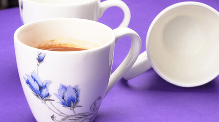 Top view of colorful working table have Headphones,mobile phone and cup of tea on color blue, Yellow and pink background for create idea for business or design. Relax time listen song (flat lay).