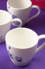 Top view of colorful working table have Headphones,mobile phone and cup of tea on color blue, Yellow and pink background for create idea for business or design. Relax time listen song (flat lay).