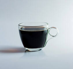 black drip coffee in glass cup  white background.