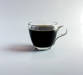 black drip coffee in glass cup  white background.
