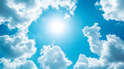 Bezchmurne niebo w odcieniach głębokiego błękitu jest ozdobione puchatymi, białymi chmurami, które delikatnie suną po horyzoncie. 