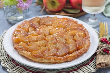 Caramelized apple Tart Tartin on plate, french upside down cake, horizontal