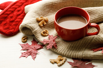 Hot chocolate drink in a red cup. Autumn Winter composition