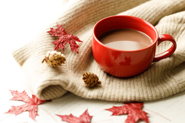 Hot chocolate drink in a red cup. Autumn Winter composition
