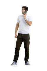 Naklejka premium A man, full-length, on a white background, talking on the phone