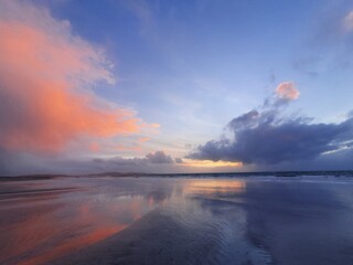 sunset reflecting in tidal pools on the beach, south uist, Outer Hebrides, Scotland, UK