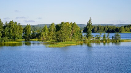 Fototapeta premium Kizhi Island, Russia, July 10, 2024. Green Cape on the lake. 