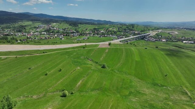 Building new road and modern viaduct through countryside in Poland, aerial view