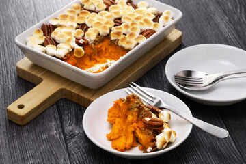 sweet potato casserole with marshmallows and pecans.  American thanksgiving dinner side dish.
