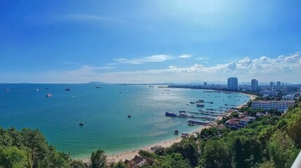 Fototapeta premium The stunning views from Pattaya Viewpoint, capturing the entire bay and city skyline under the bright blue sky.