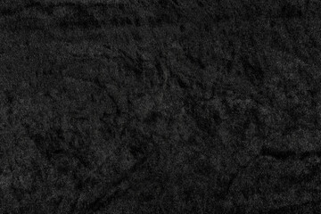 Luxurious black velvet fabric texture with soft, plush pile