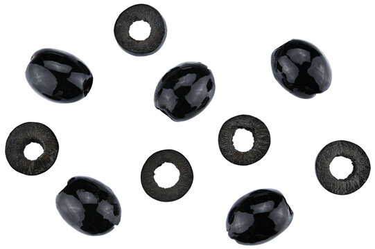Scattered natural pitted black olives preserved and sliced isolated on a transparent background. Completely in focus. Top view.