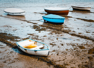 Row Gigs Moored At Shaldon Beach In Devon At Low Tide