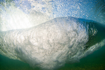 Underwater view below the breaking wave.