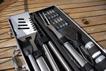 Barbecue tools close up. Set of cooking tools. Metal tongs and spatulas. Homemade food