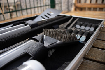 Barbecue tools close up. Set of cooking tools. Metal tongs and spatulas. Homemade food