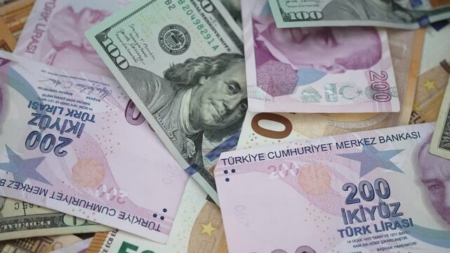 Table displays Turkish lira alongside dollar and euro bills showing severe effects of hyperinflation reducing lira worth in comparison to more stable currencies