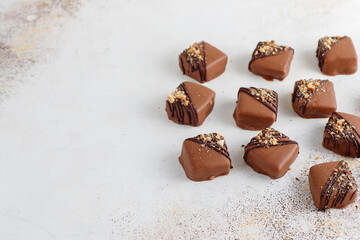 Handmade chocolate with pistachios, dark and milk chocolate pieces.