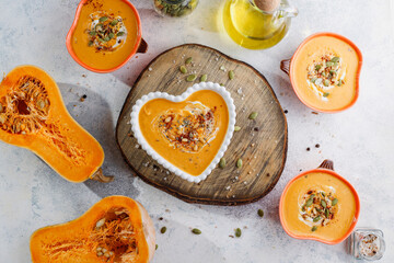 Traditional autumn butternut squash soup with seeds.