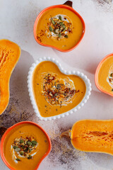 Traditional autumn butternut squash soup with seeds.