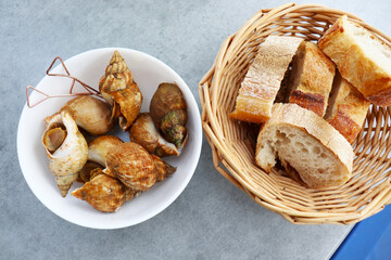 edible escargot snails on a white plate