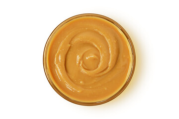 Peanut butter in glass bowl on white background