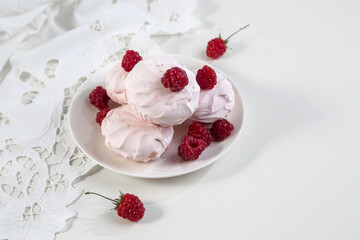 Marshmallow cookies with fresh raspberries for tea, selective focus