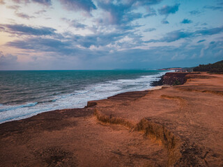 Beach seen from the top of the mountain, blue sky, nature, mountain, cliffs, Tropical climate, summer climate, beach day - Photo in Praia da Pipa - RN, Brazil